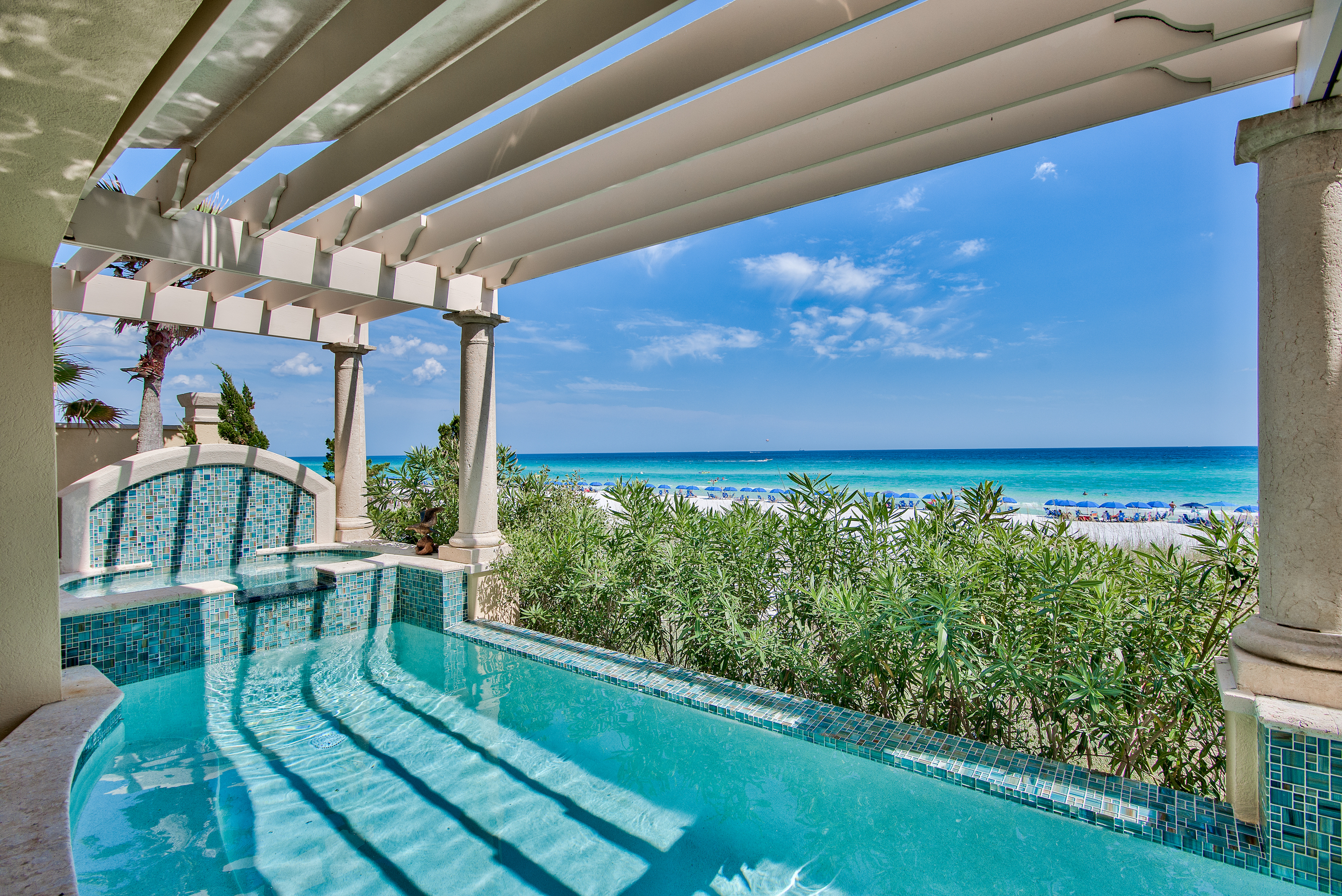 A view of turquoise Gulf waters from the private covered outdoor door of a Gulf front home in Destin