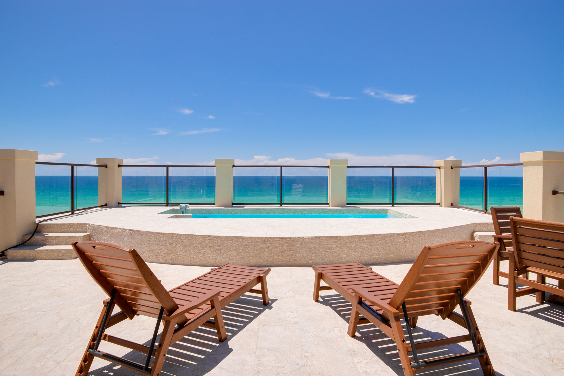 A view of turquoise Gulf waters from the rooftop terrace pool at a Gulf front home in Destiny By The Sea