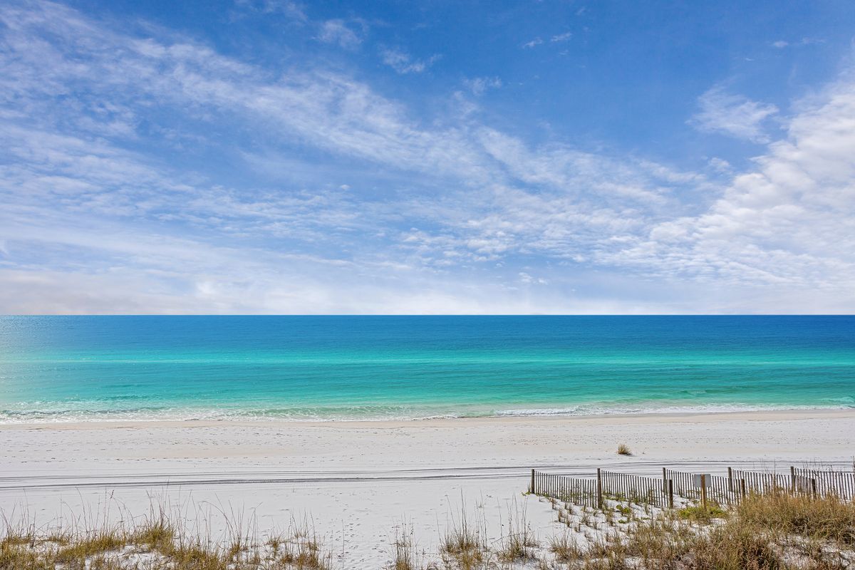 A view of the beach and Gulf on 30A on a sunny day