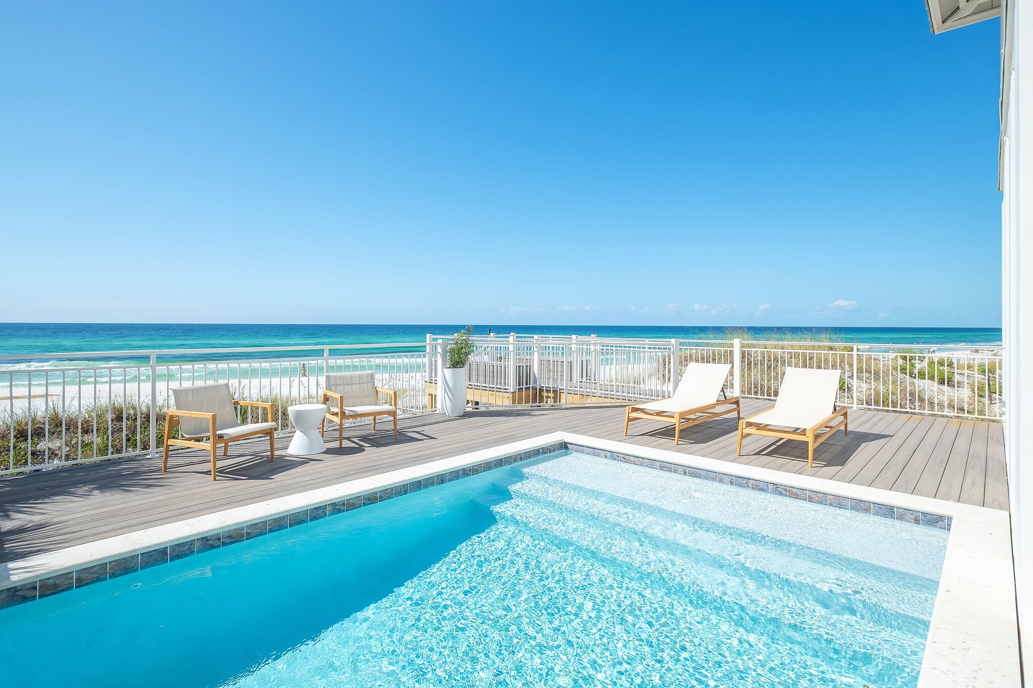 The view of the beach from the private pool of one of 30A's luxury gulf front homes