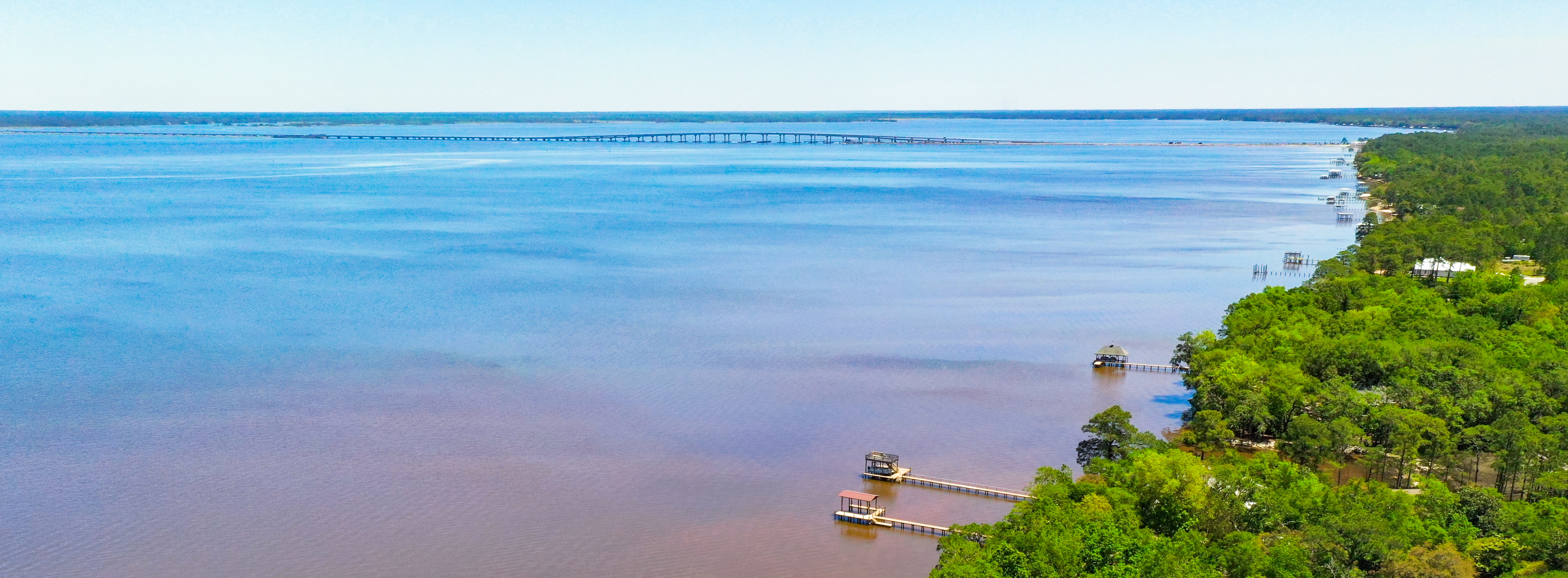 An aerial view of Choctawhatchee Bay in Santa Rosa Beach highlighting some of the private boat docks