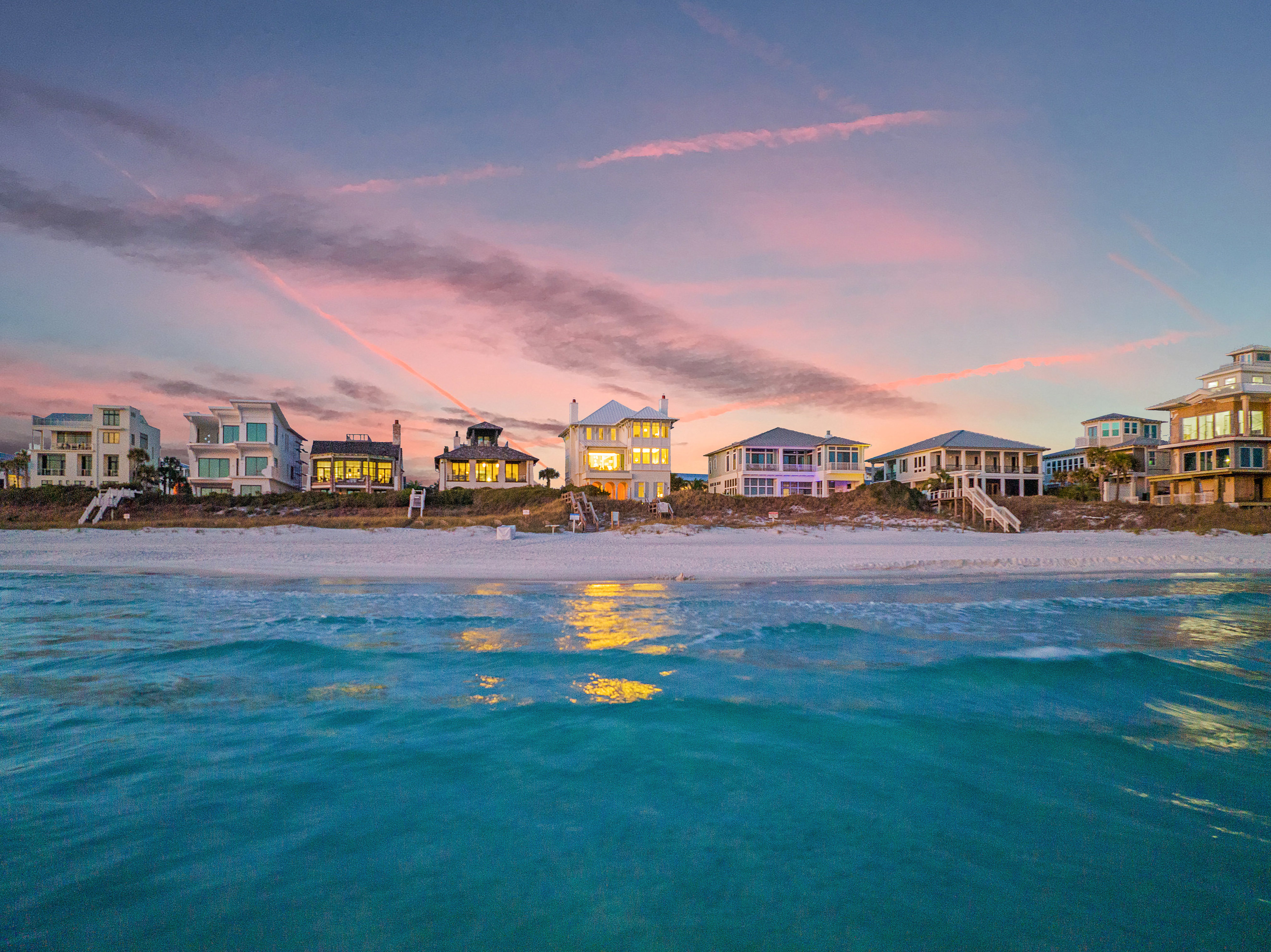 An exceptional beach sunset over the Gulf front homes along 30A.
